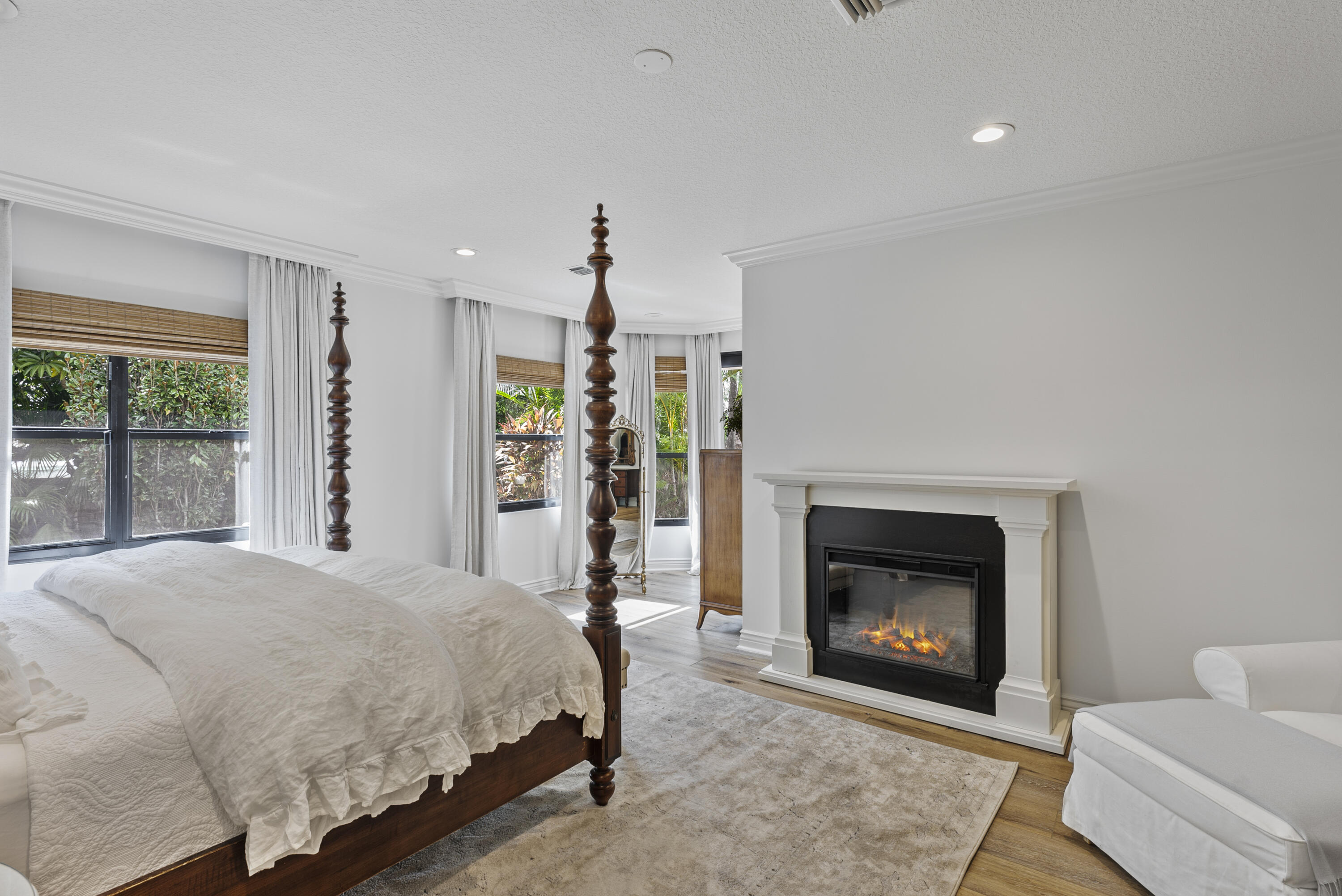 1925 Parkside Circle South Boca Raton, FL 33486 - Photo 39 of 61 a spacious bedroom with a bed and a fireplace