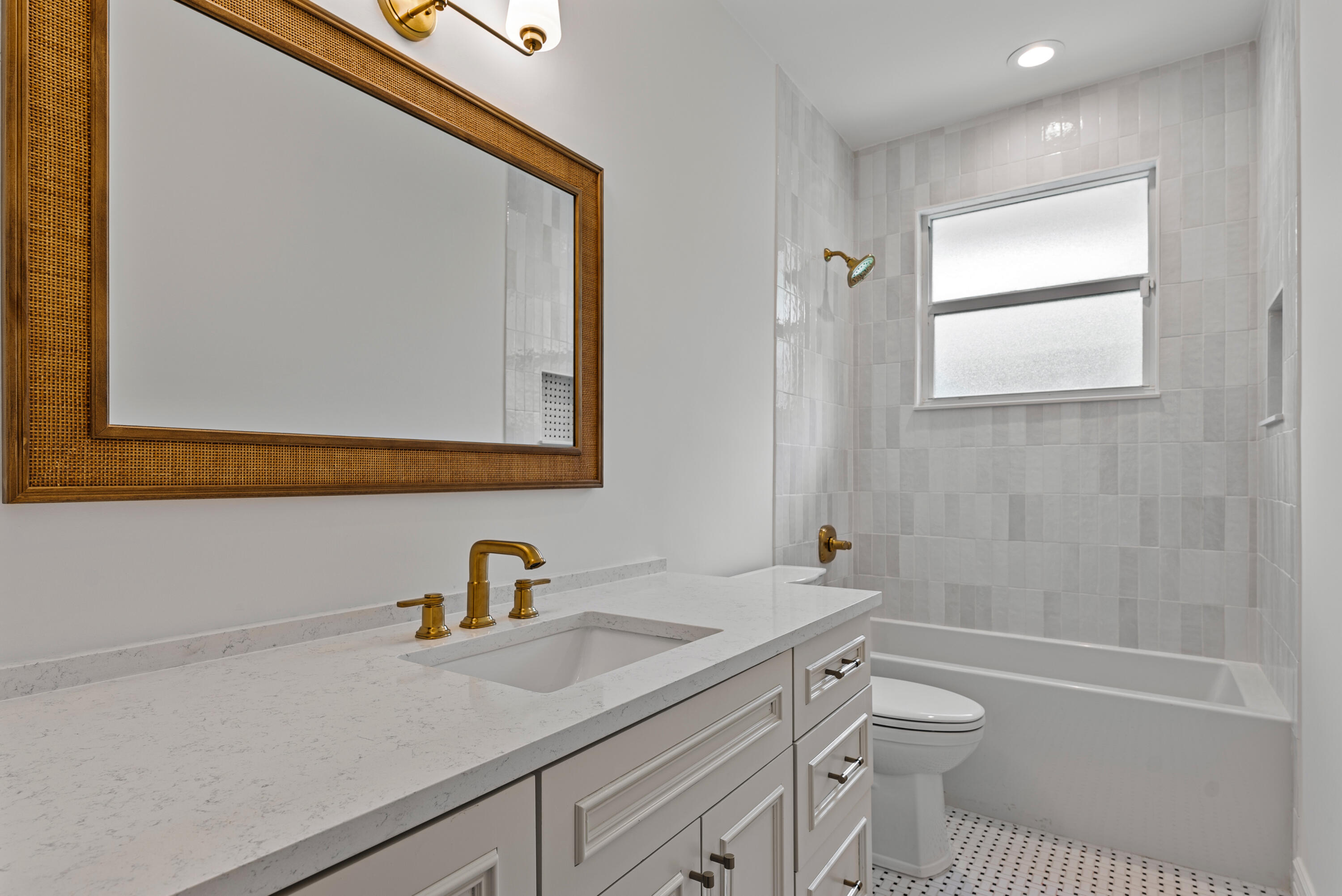 1925 Parkside Circle South Boca Raton, FL 33486 - Photo 43 of 61 a bathroom with a sink a toilet and a bathtub