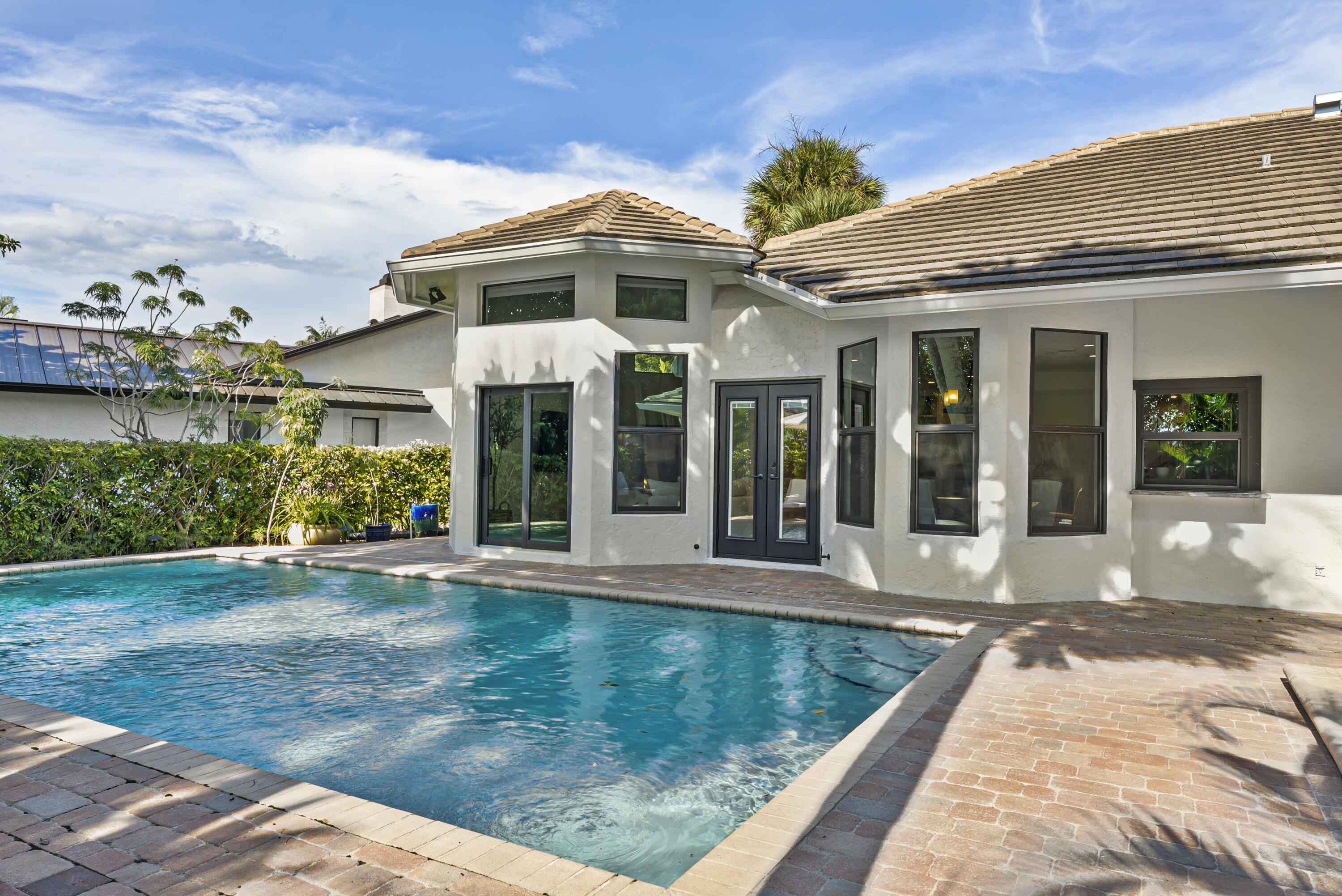1925 Parkside Circle South Boca Raton, FL 33486 - Photo 49 of 61 a front view of a house with garden