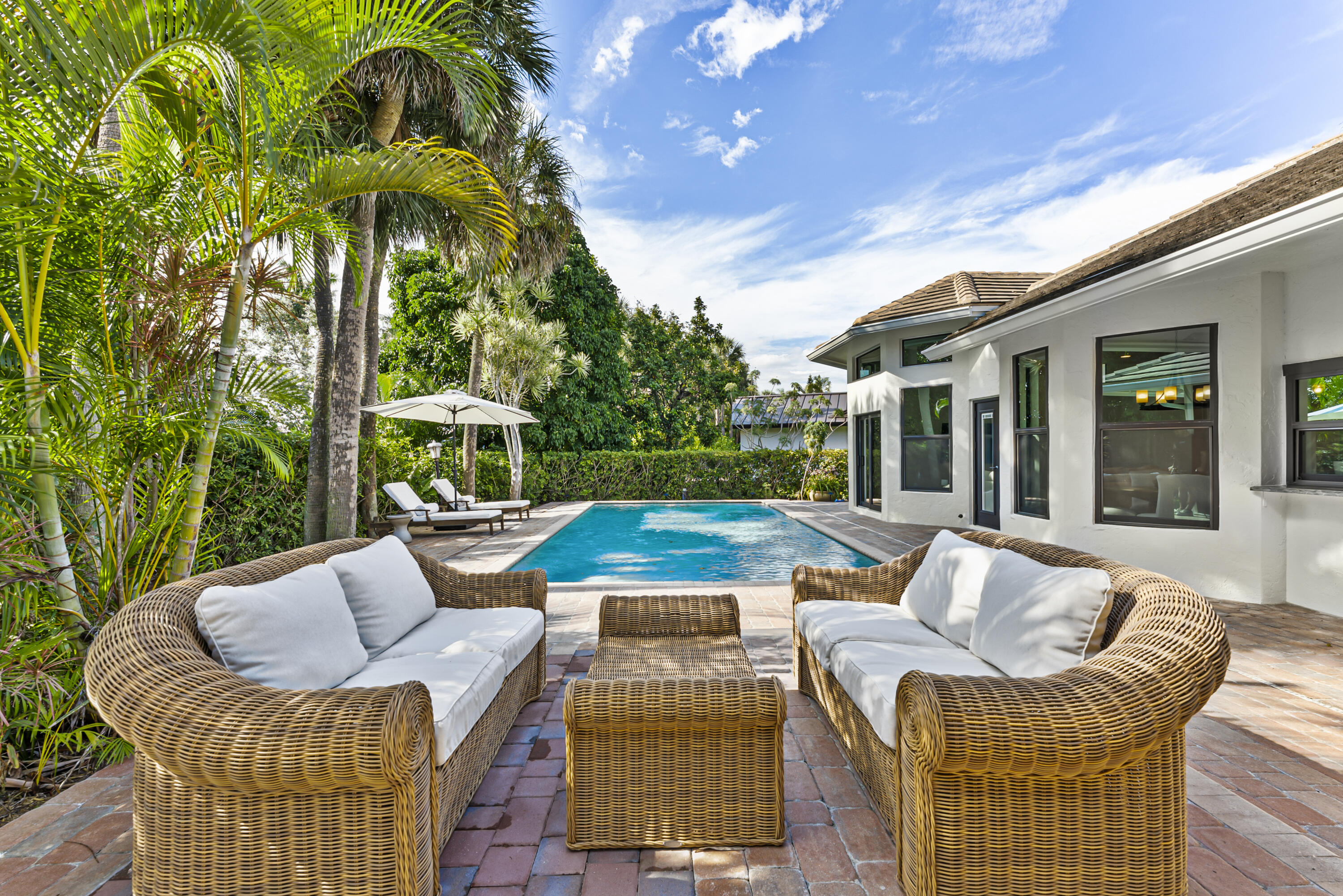 1925 Parkside Circle South Boca Raton, FL 33486 - Photo 5 of 61 a view of a patio with couches chairs and a table and chairs