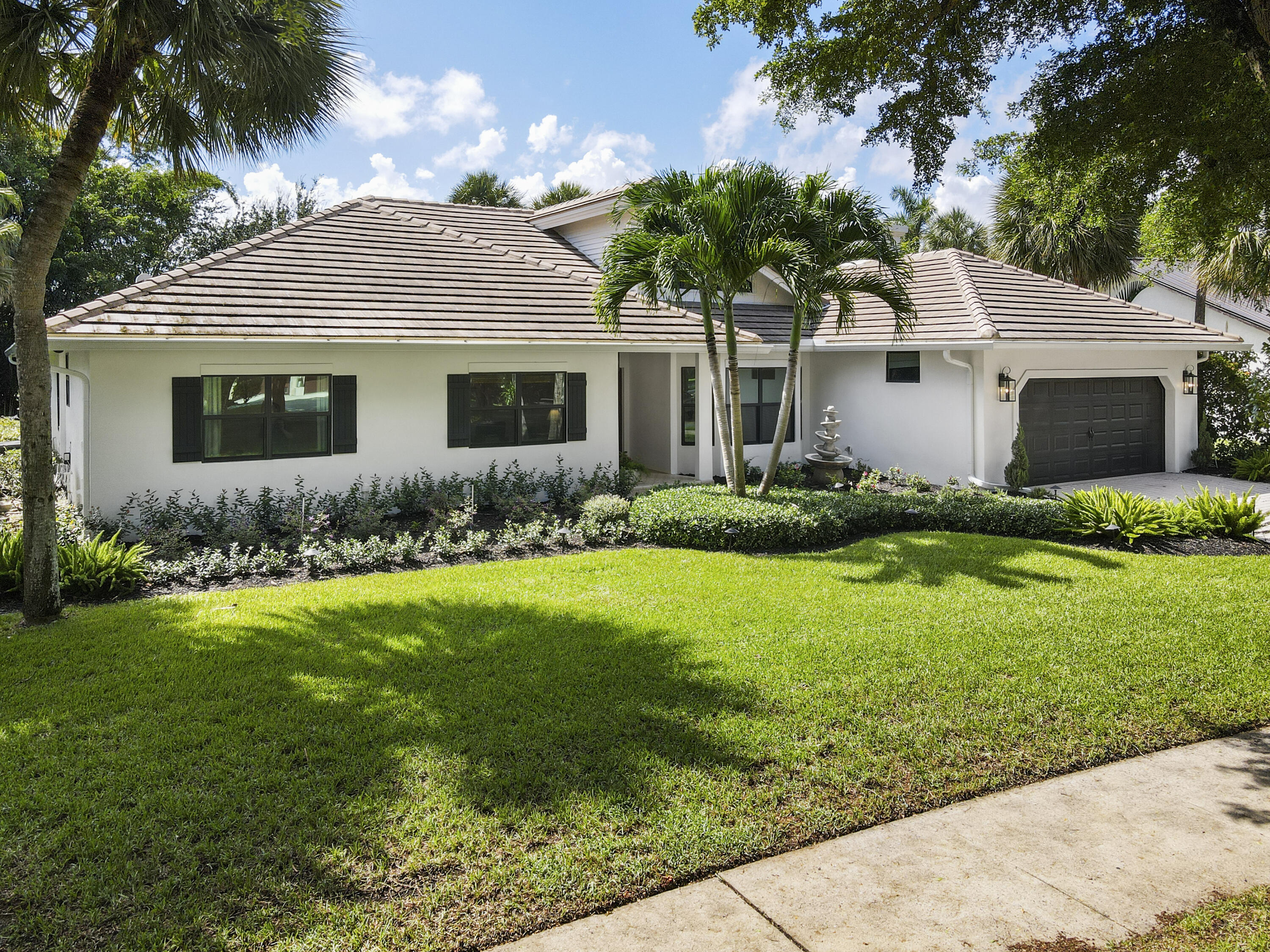 1925 Parkside Circle South Boca Raton, FL 33486 - Photo 59 of 61 a front view of house with yard and green space