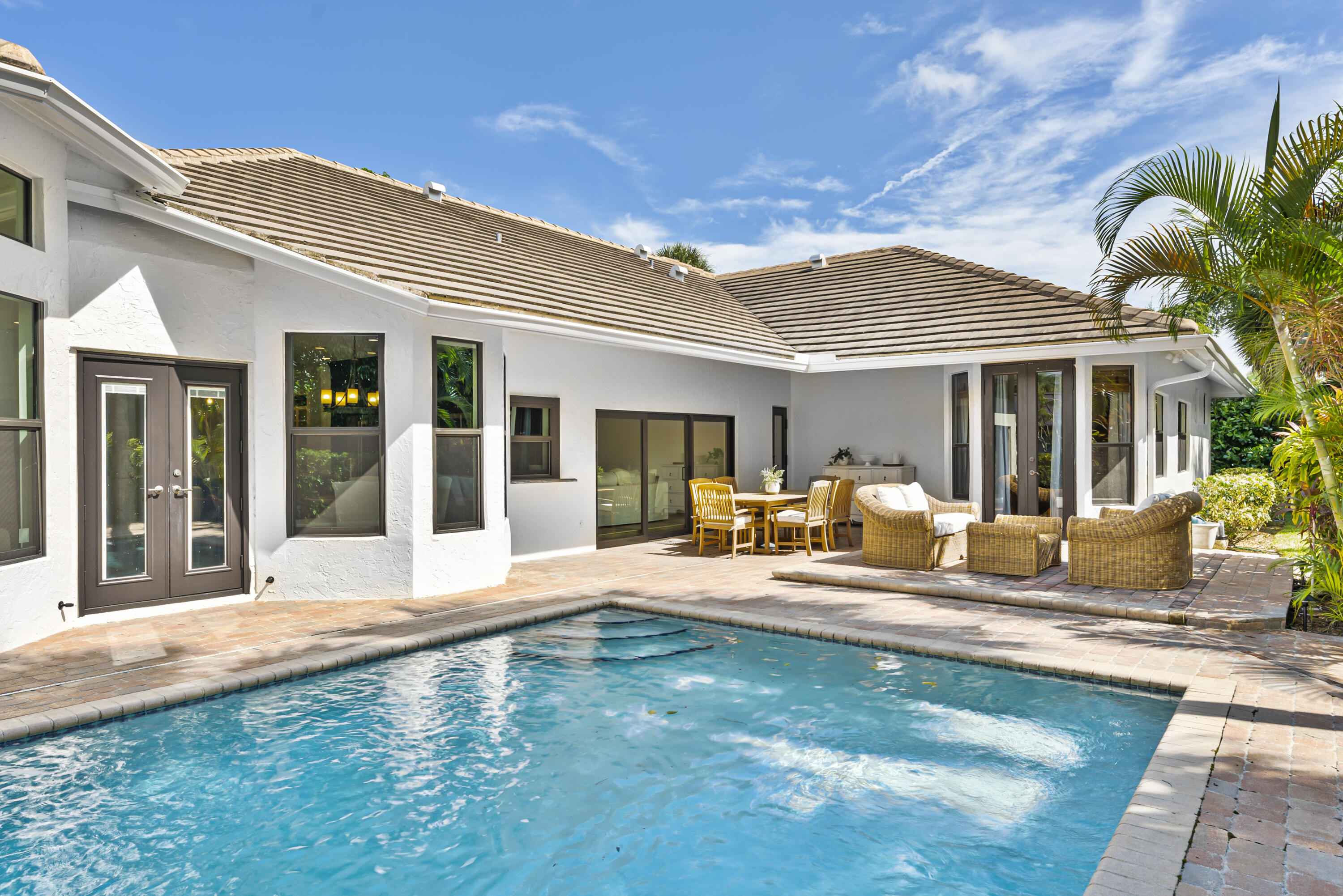 1925 Parkside Circle South Boca Raton, FL 33486 - Photo 6 of 61 a house view with swimming pool in front of it
