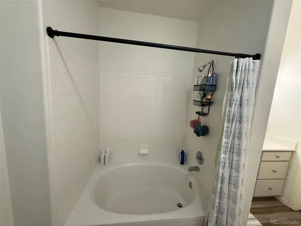 a bedroom with a bed and a desk