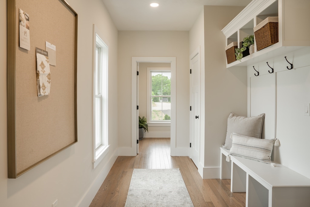 20 Metacomet Road, Unit 20 West Bridgewater, MA 02379 - Photo 12 of 30 a living room with furniture and a table