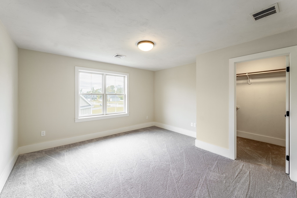 20 Metacomet Road, Unit 20 West Bridgewater, MA 02379 - Photo 23 of 30 an empty room with windows and closet