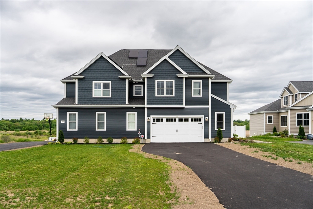 20 Metacomet Road, Unit 20 West Bridgewater, MA 02379 - Photo 25 of 30 a front view of a house with a yard
