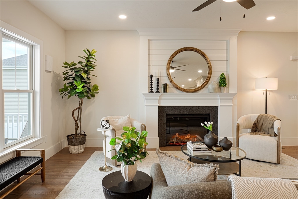 20 Metacomet Road, Unit 20 West Bridgewater, MA 02379 - Photo 3 of 30 a living room with furniture and a fireplace