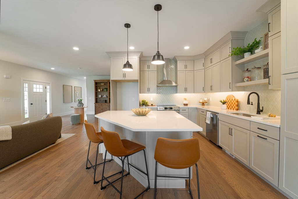 20 Metacomet Road, Unit 20 West Bridgewater, MA 02379 - Photo 6 of 30 a large kitchen with a table and chairs