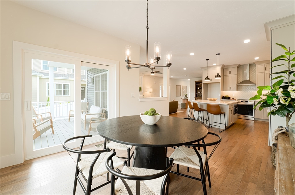 20 Metacomet Road, Unit 20 West Bridgewater, MA 02379 - Photo 10 of 30 a view of a dining room with furniture window and wooden floor