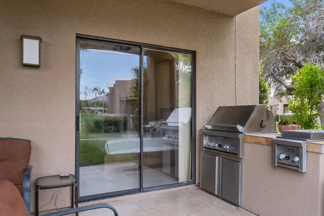 a kitchen with a refrigerator and a trees