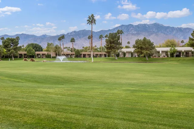 a view of a town with a building in the background