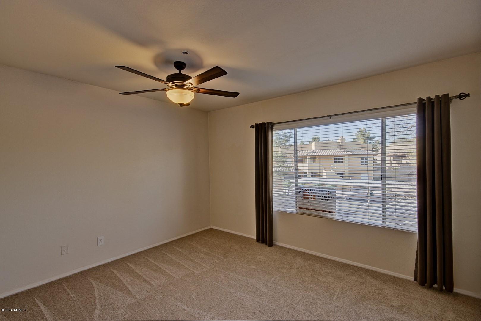 1825 West Ray Road, Unit 2055 Chandler, AZ 85224 - Photo 11 of 28 a view of an empty room with a window