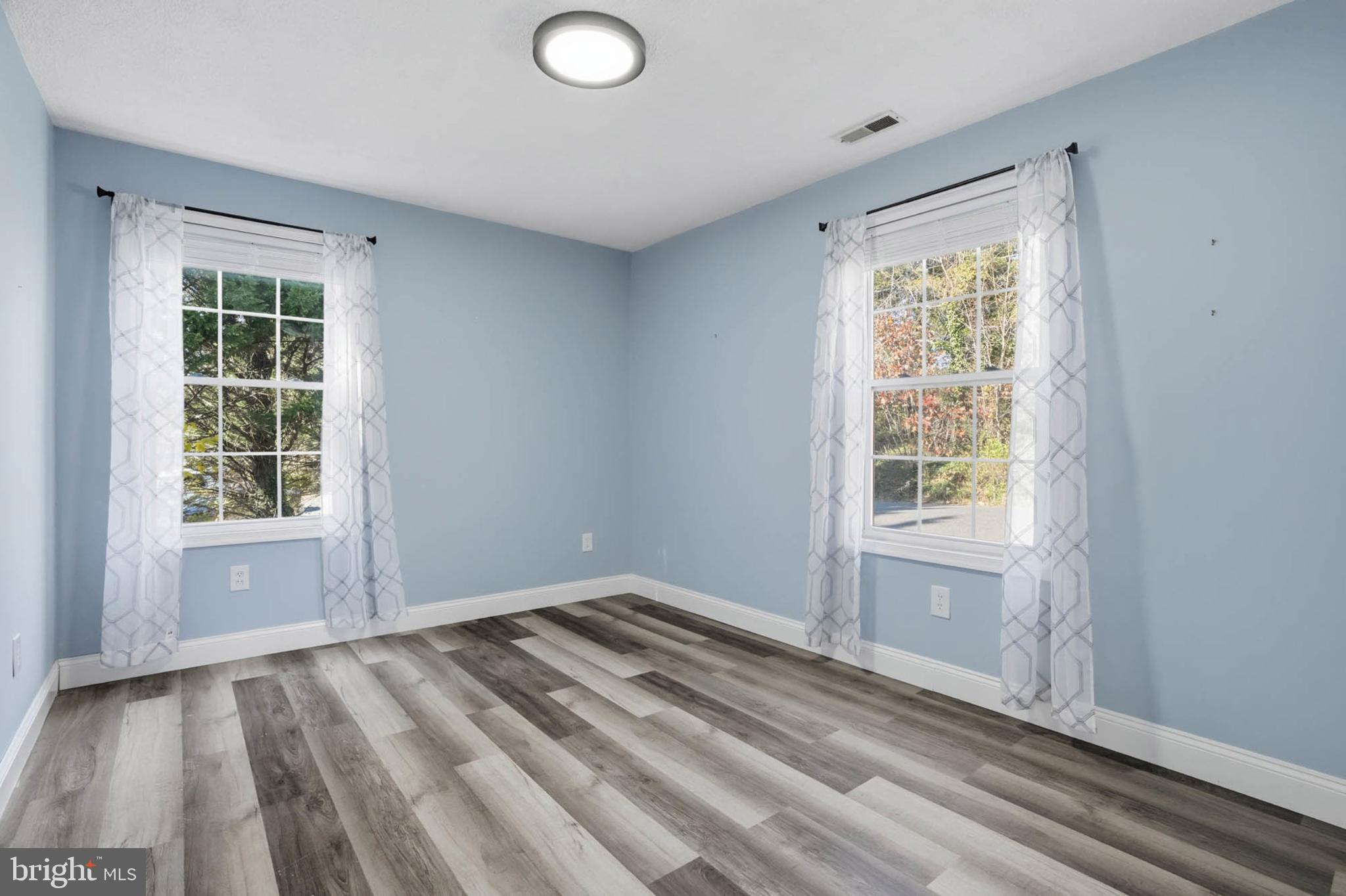 2405 Jerusalem Road Joppa, MD 21085 - Photo 13 of 23 Bright and airy room with serene blue walls.