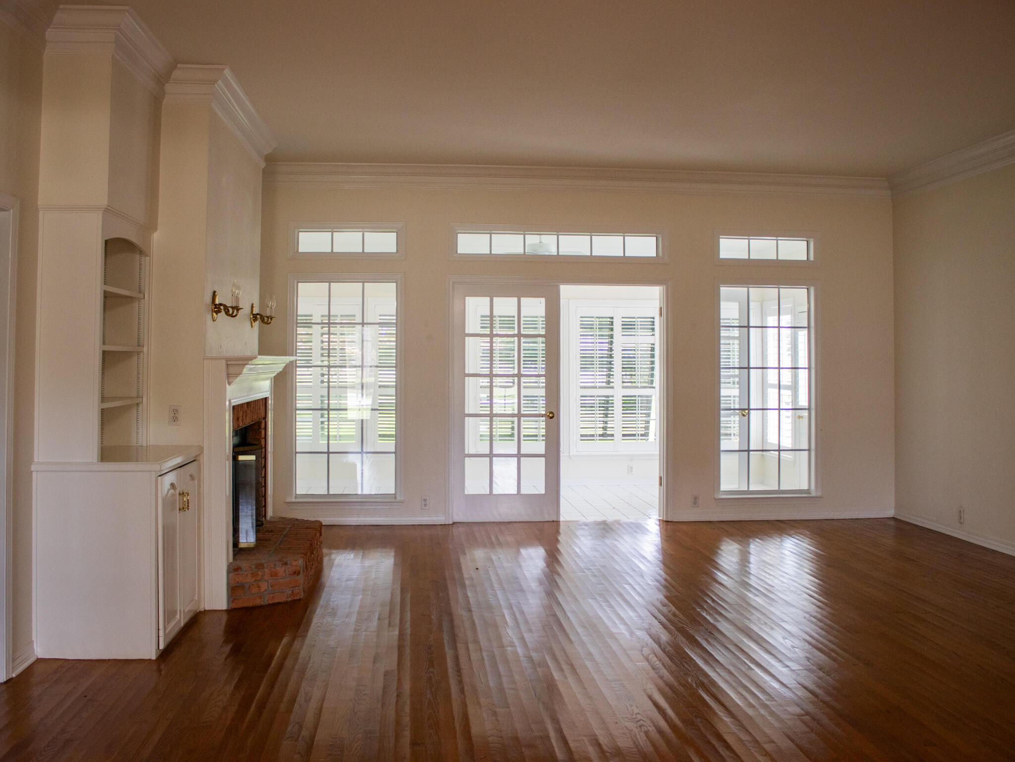 118 Baywind Drive Niceville, FL 32578 - Photo 1 of 27 wooden floor in an empty room with a window