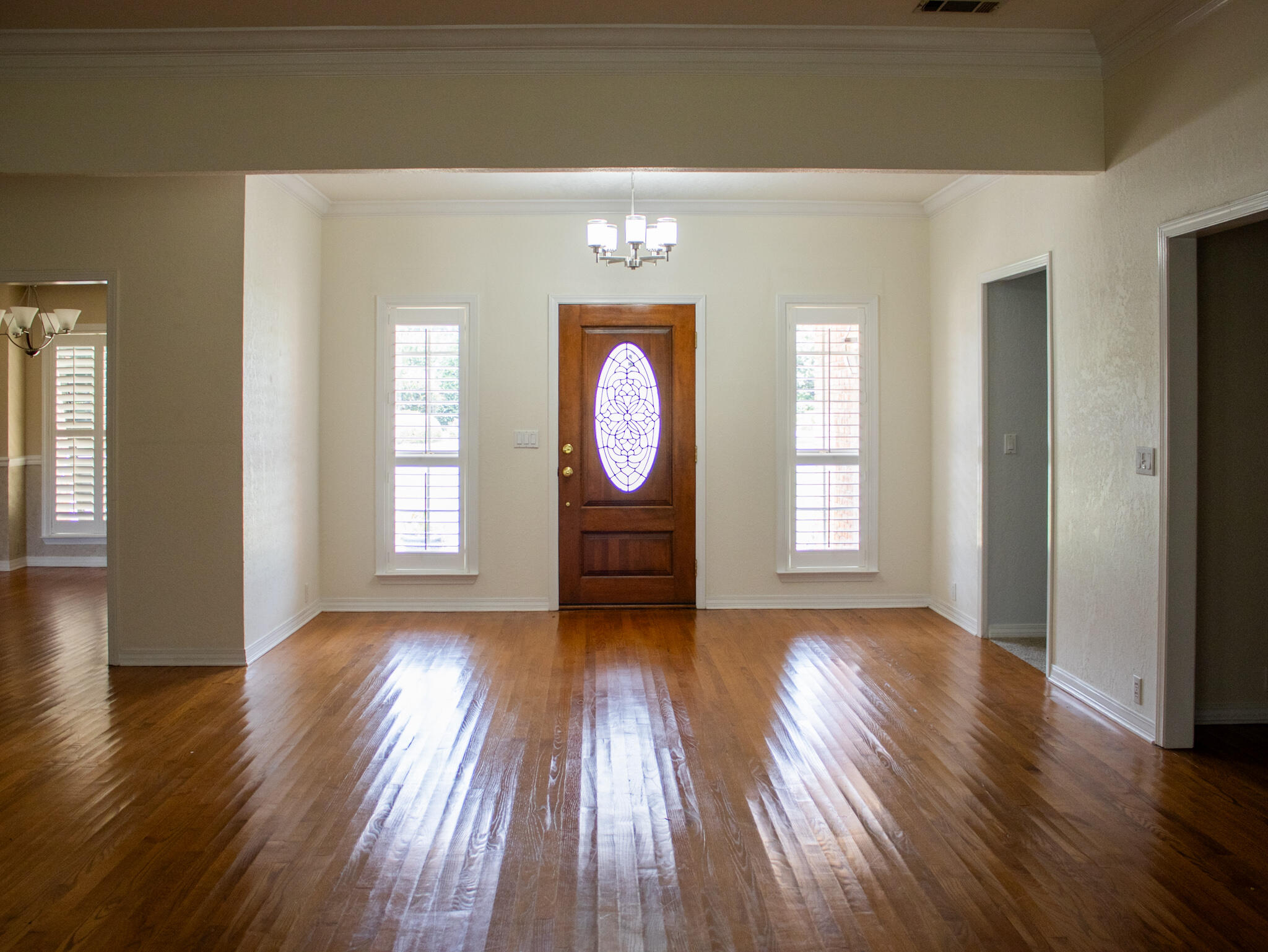 118 Baywind Drive Niceville, FL 32578 - Photo 2 of 27 a view of a room with wooden floors and window