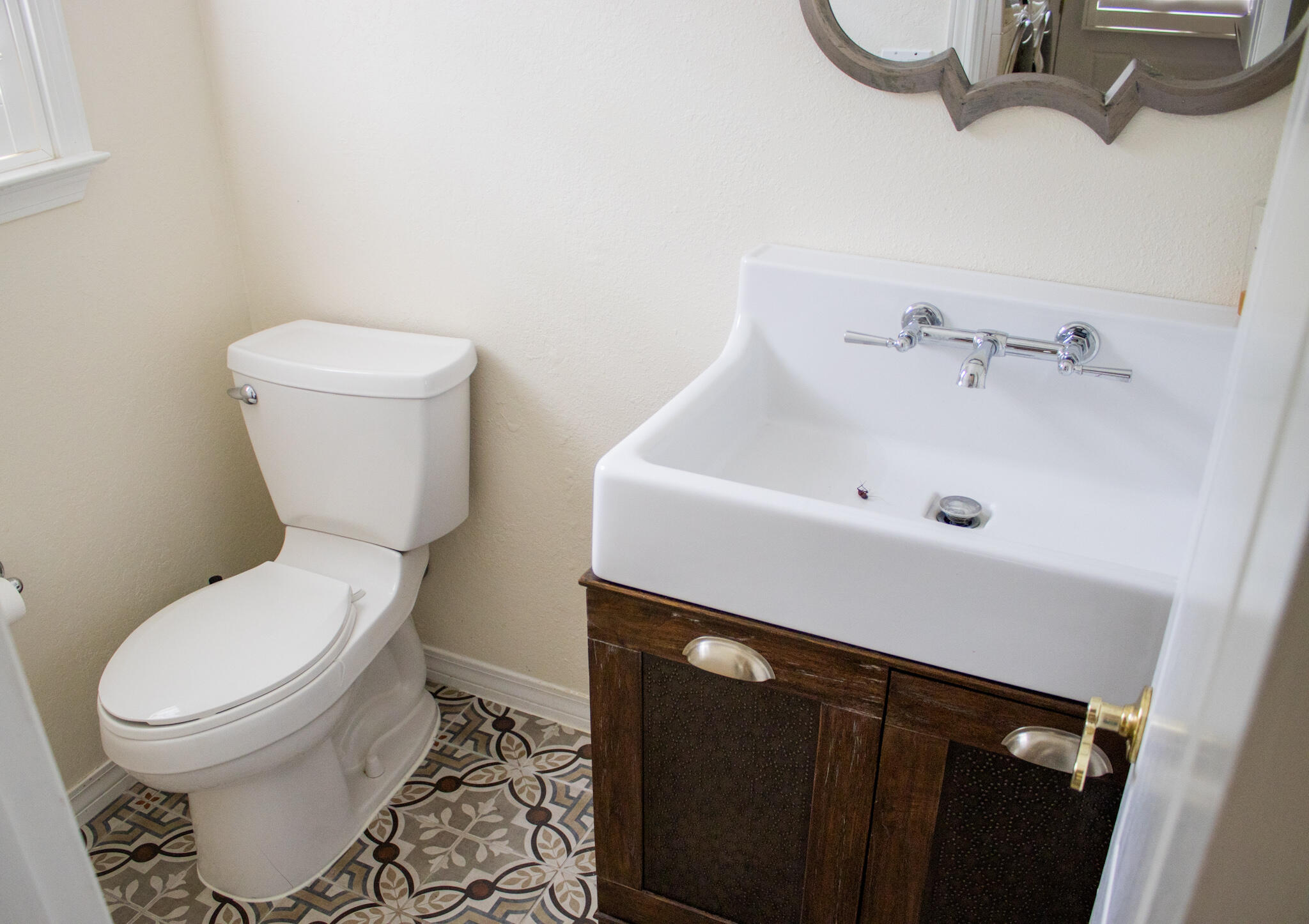 118 Baywind Drive Niceville, FL 32578 - Photo 23 of 27 a white toilet sitting next to a bathroom sink