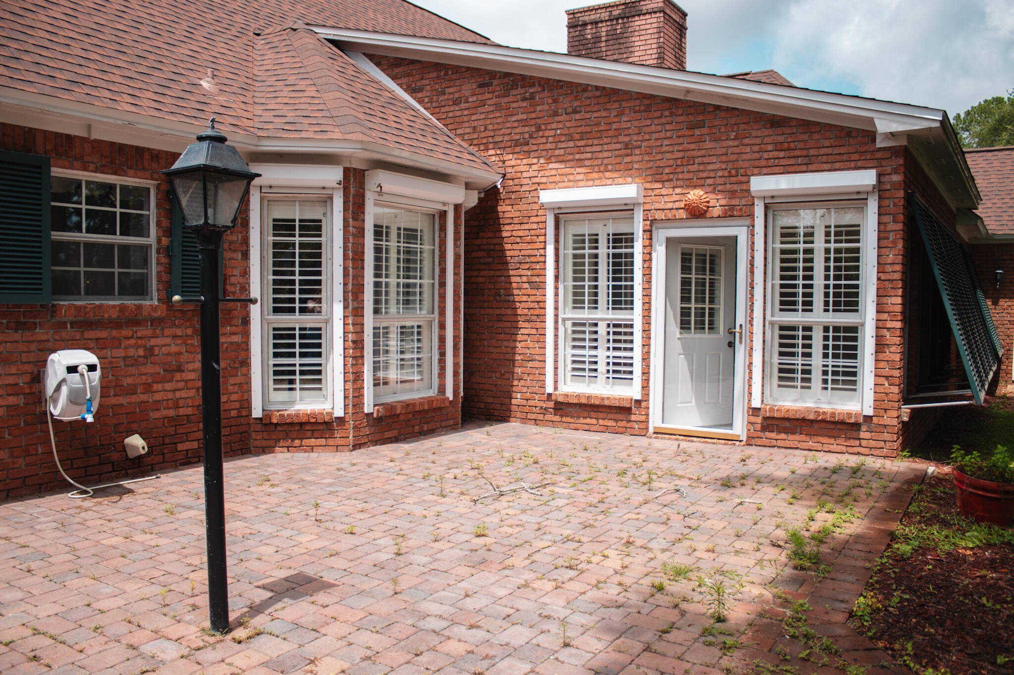 118 Baywind Drive Niceville, FL 32578 - Photo 25 of 27 a front view of a house with a patio