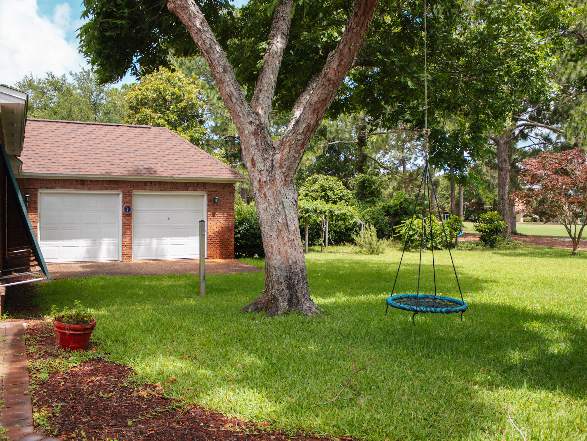 118 Baywind Drive Niceville, FL 32578 - Photo 26 of 27 a view of a backyard with a garden