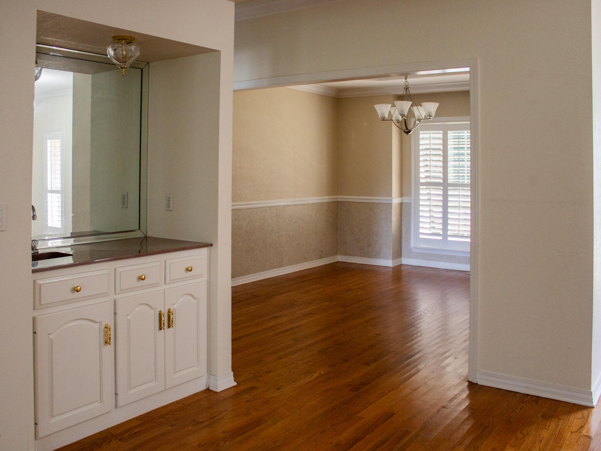 118 Baywind Drive Niceville, FL 32578 - Photo 5 of 27 a view of walk in closet with wooden floor and cabinet