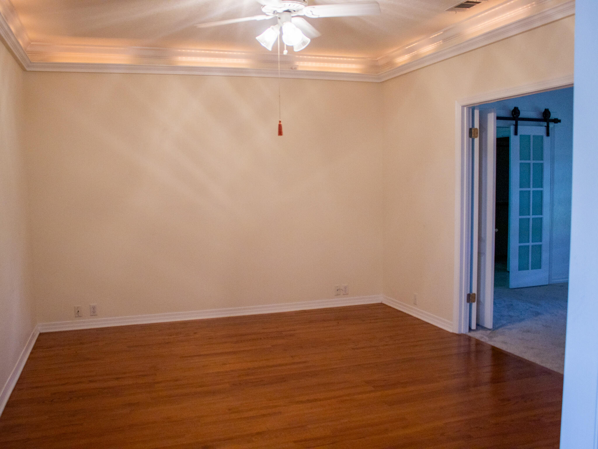 118 Baywind Drive Niceville, FL 32578 - Photo 6 of 27 a view of an empty room with wooden floor