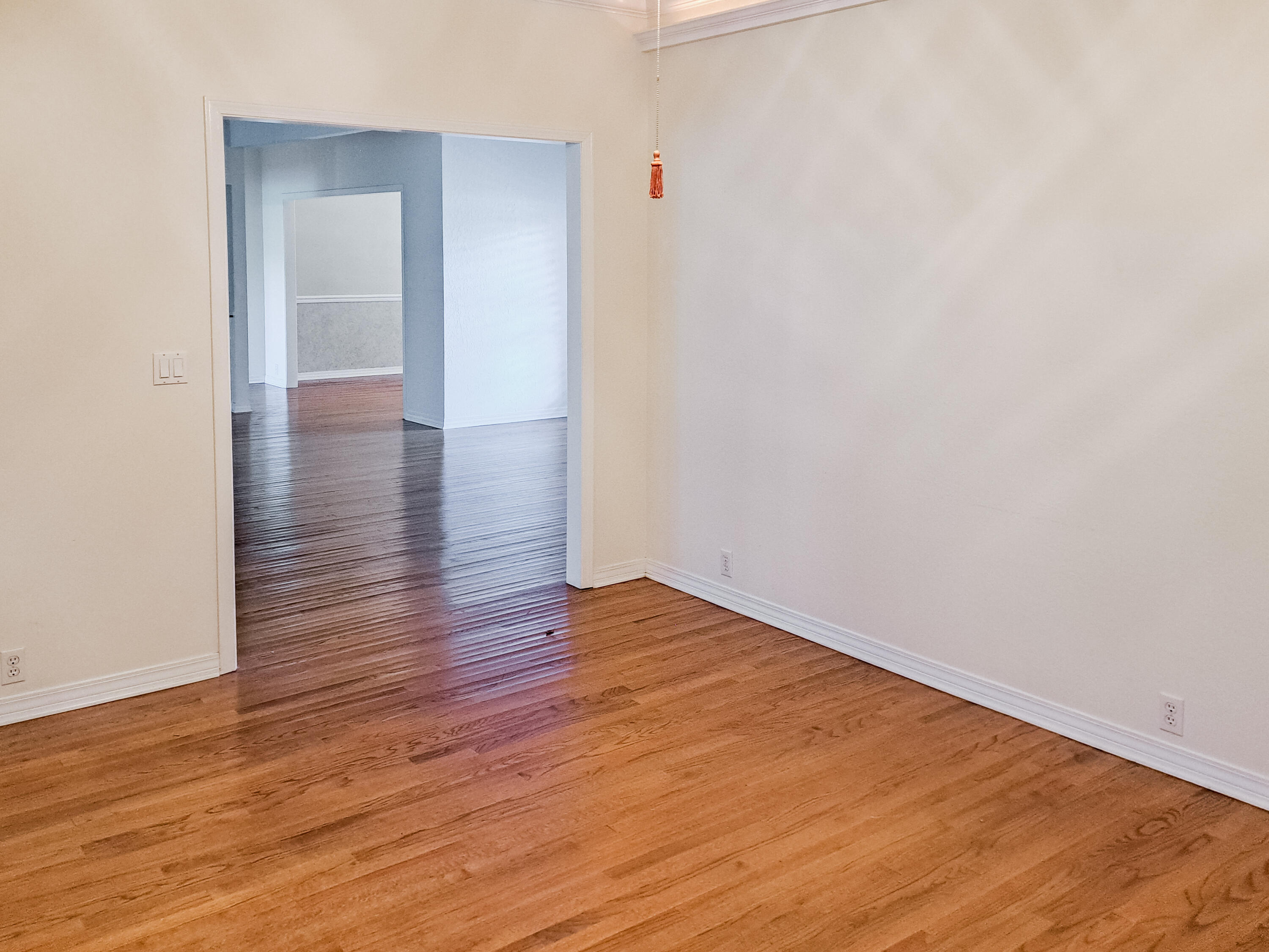118 Baywind Drive Niceville, FL 32578 - Photo 7 of 27 a view of an empty room with wooden floor