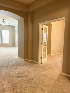 11713 Dunblane Way Austin, TX 78754 - Photo 10 of 22 Beige carpeting and neutral wall tones throughout the interior