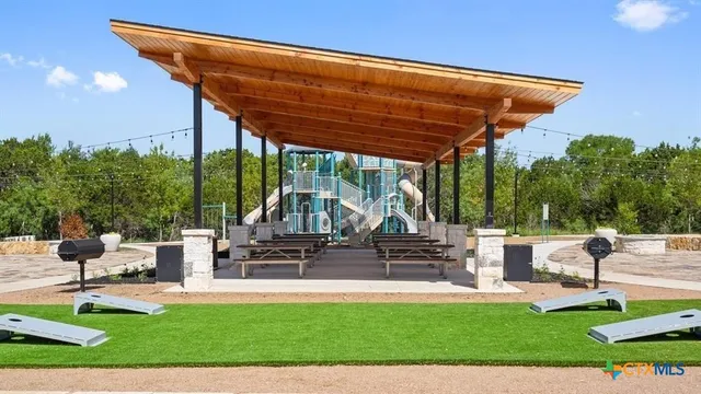 a view of a patio with a table chairs and a patio