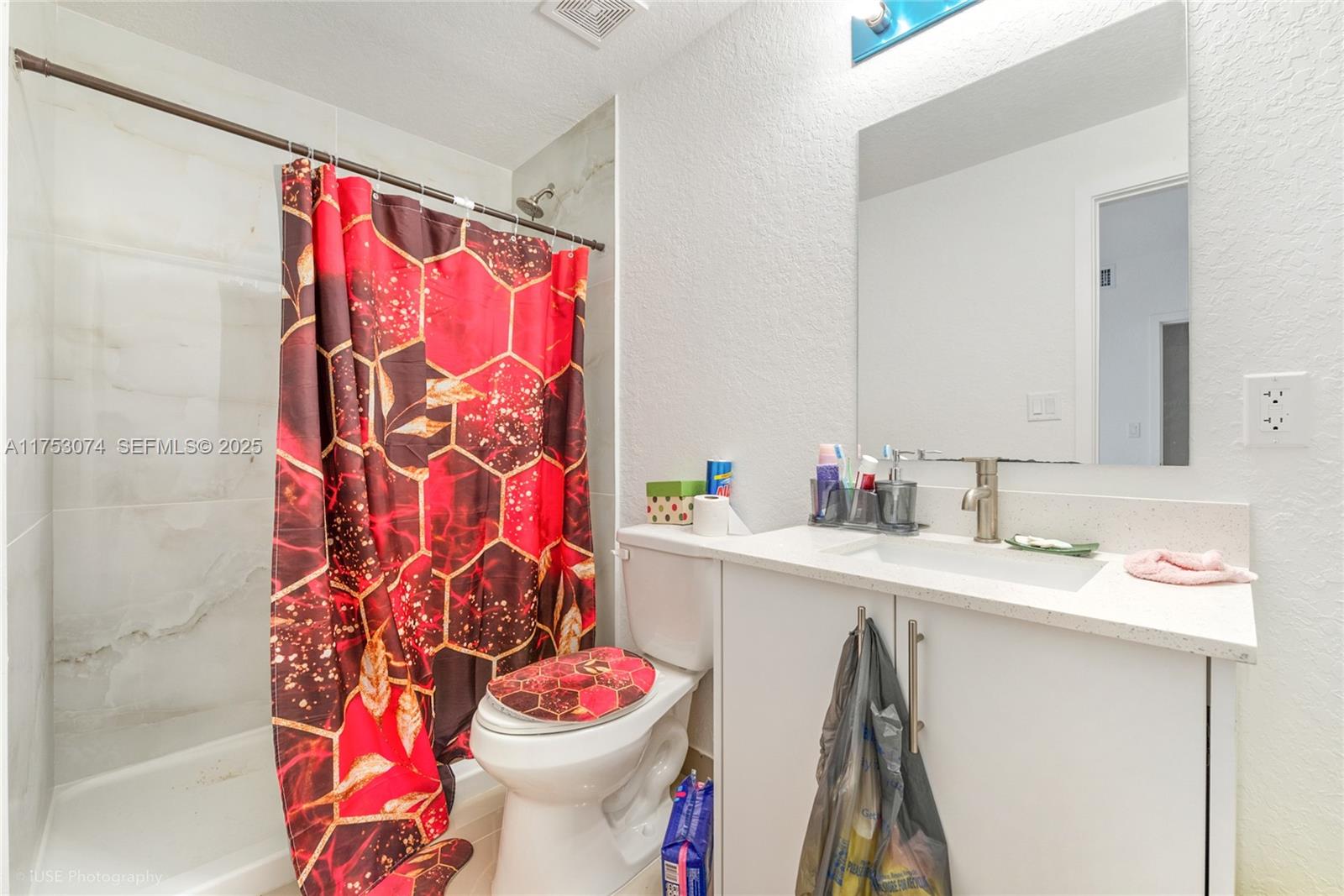 25616 Southwest 143rd Avenue Homestead, FL 33032 - Photo 10 of 12 a bathroom with a sink toilet and shower