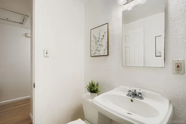 a white bath tub sitting next to a white sink