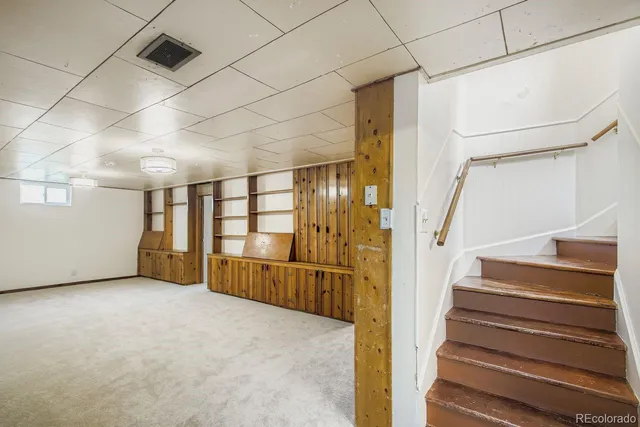 a view of an empty room with stairs