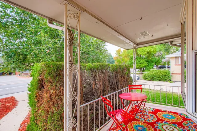 a view of balcony with furniture