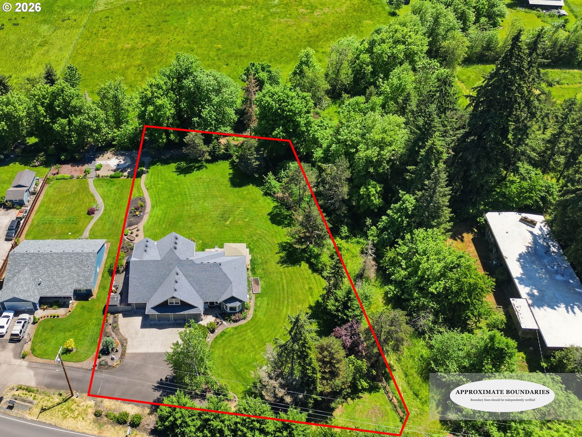 29778 Gimpl Hill Road Eugene, OR 97405 - Photo 4 of 43 an aerial view of a house with a garden and lake view