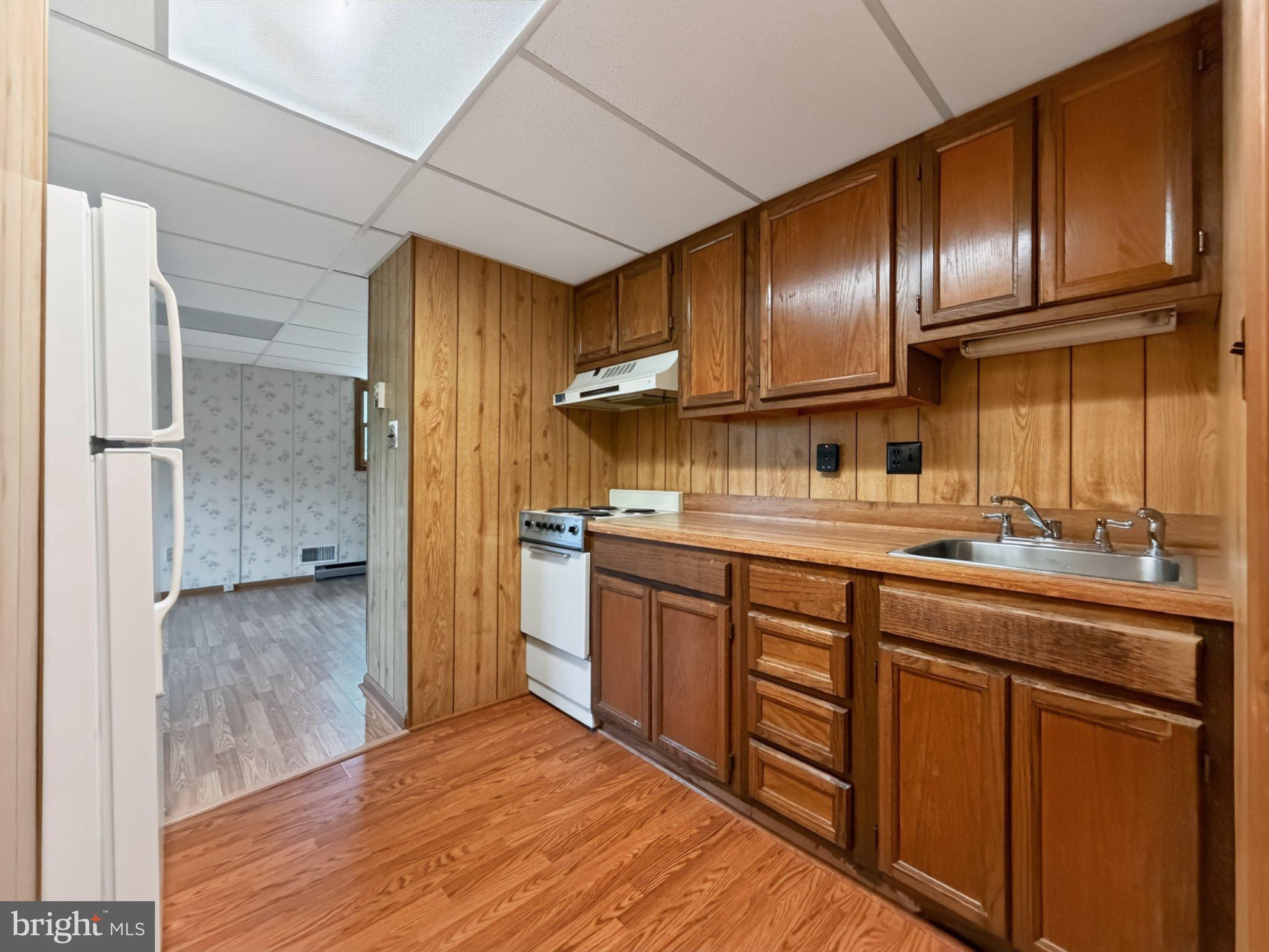 30075 Huntt Road Mechanicsville, MD 20659 - Photo 15 of 21 Cozy kitchen with warm wood accents.