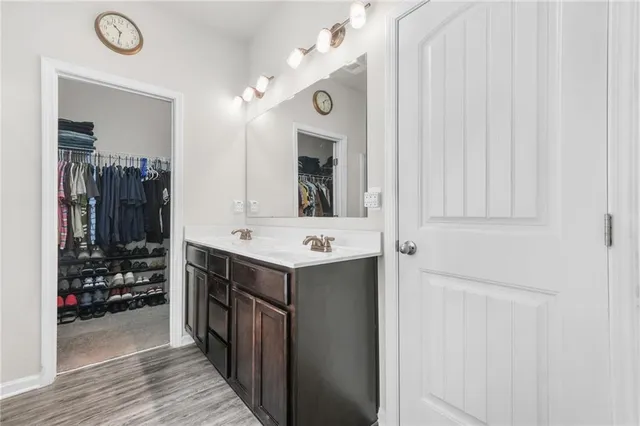 a kitchen with a sink and a refrigerator