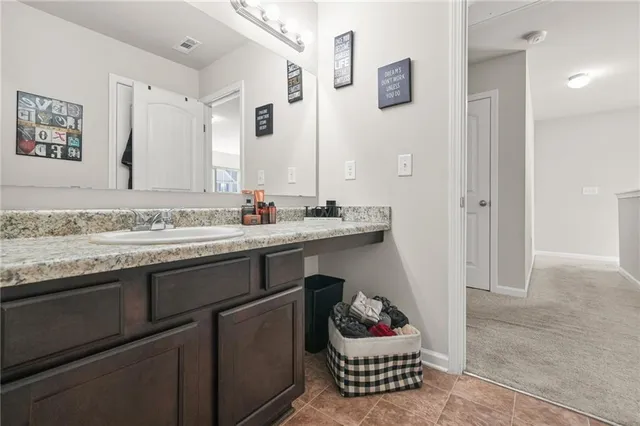 a bathroom with a toilet and shower