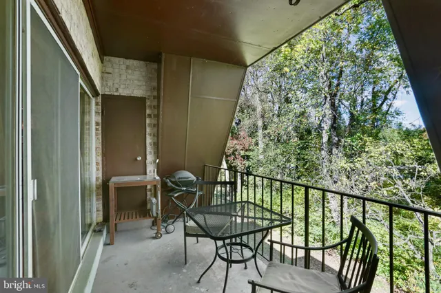 a view of a balcony with chairs