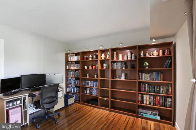 a view of a workspace with bookshelf