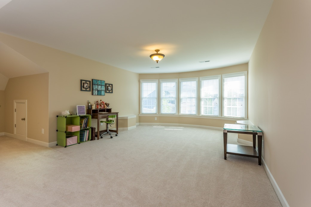 1908 Falls Farm Crossing Raleigh, NC 27614 - Photo 21 of 25 Great 4 sleepovers, movie night, music practice or an independent teen. Enormous! Curved wall of windows. Up to 10' ceilings. Comes with its own half bath w/low maintenance solid surface counter. Full height access to HVAC. Ample finished storage. Bonus Room