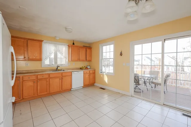 a large kitchen with a window
