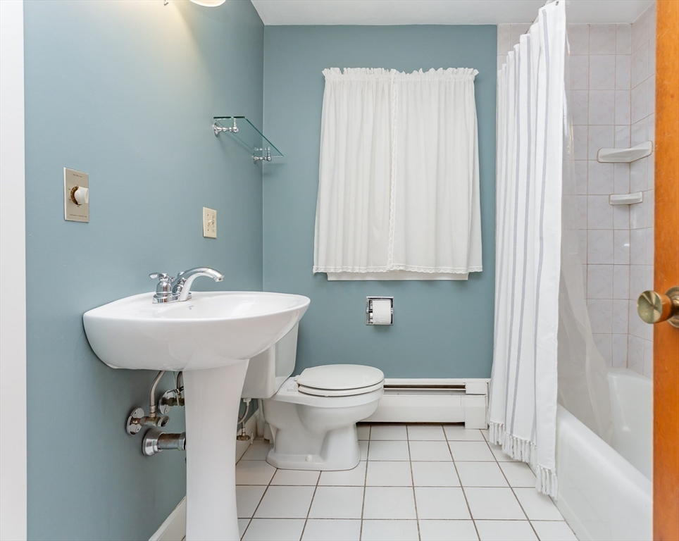 89 Jackson Drive Raynham, MA 02767 - Photo 17 of 30 a bathroom with a sink a toilet and shower
