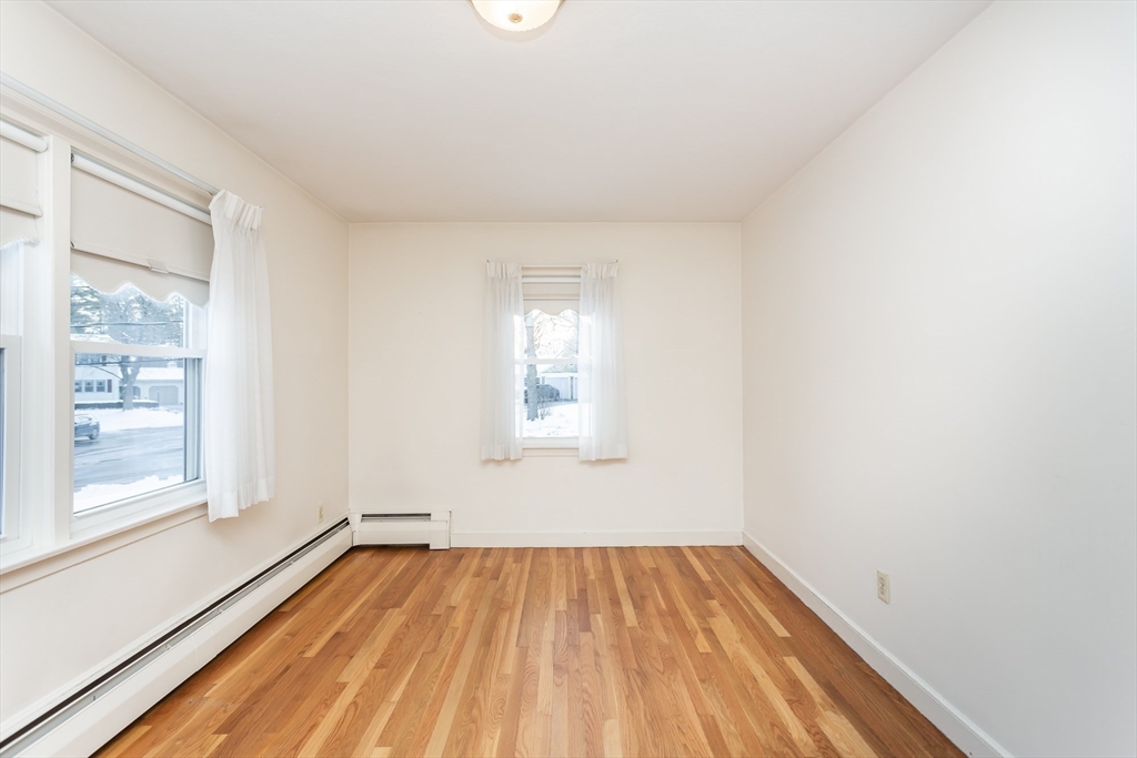 89 Jackson Drive Raynham, MA 02767 - Photo 19 of 30 a view of a room with wooden floor and window