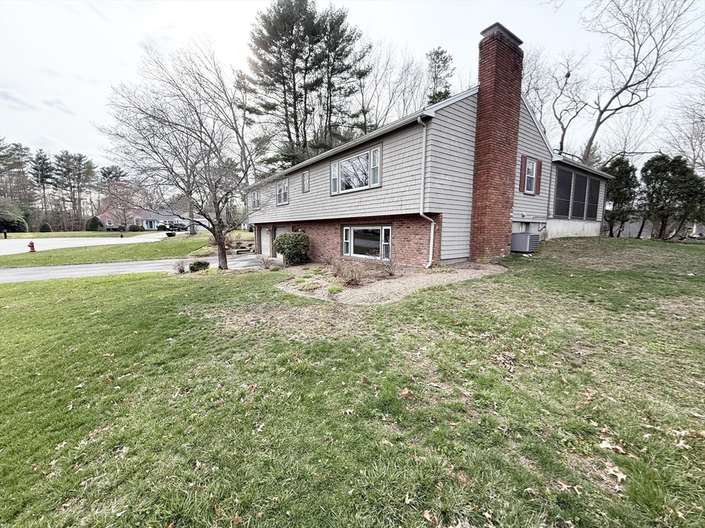 89 Jackson Drive Raynham, MA 02767 - Photo 29 of 30 a view of a house with a yard and trees