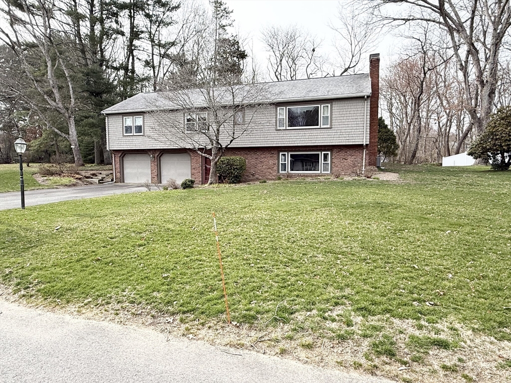 89 Jackson Drive Raynham, MA 02767 - Photo 30 of 30 a house view with a garden space