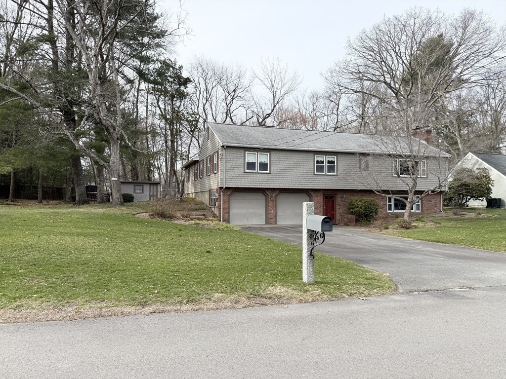89 Jackson Drive Raynham, MA 02767 - Photo 4 of 30 a front view of a house with garden