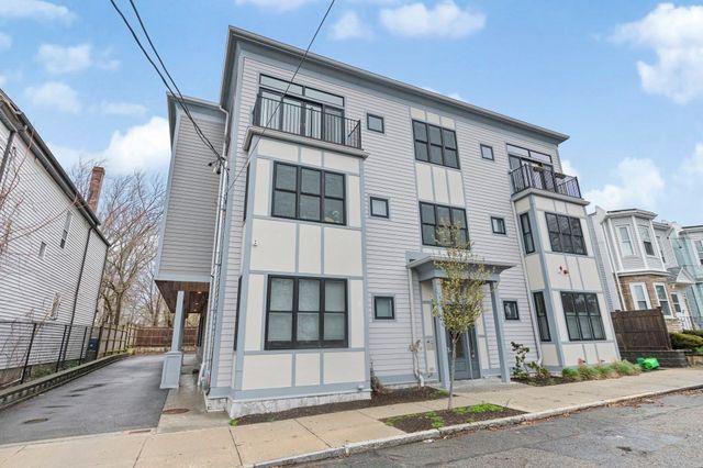 a front view of a building with a street