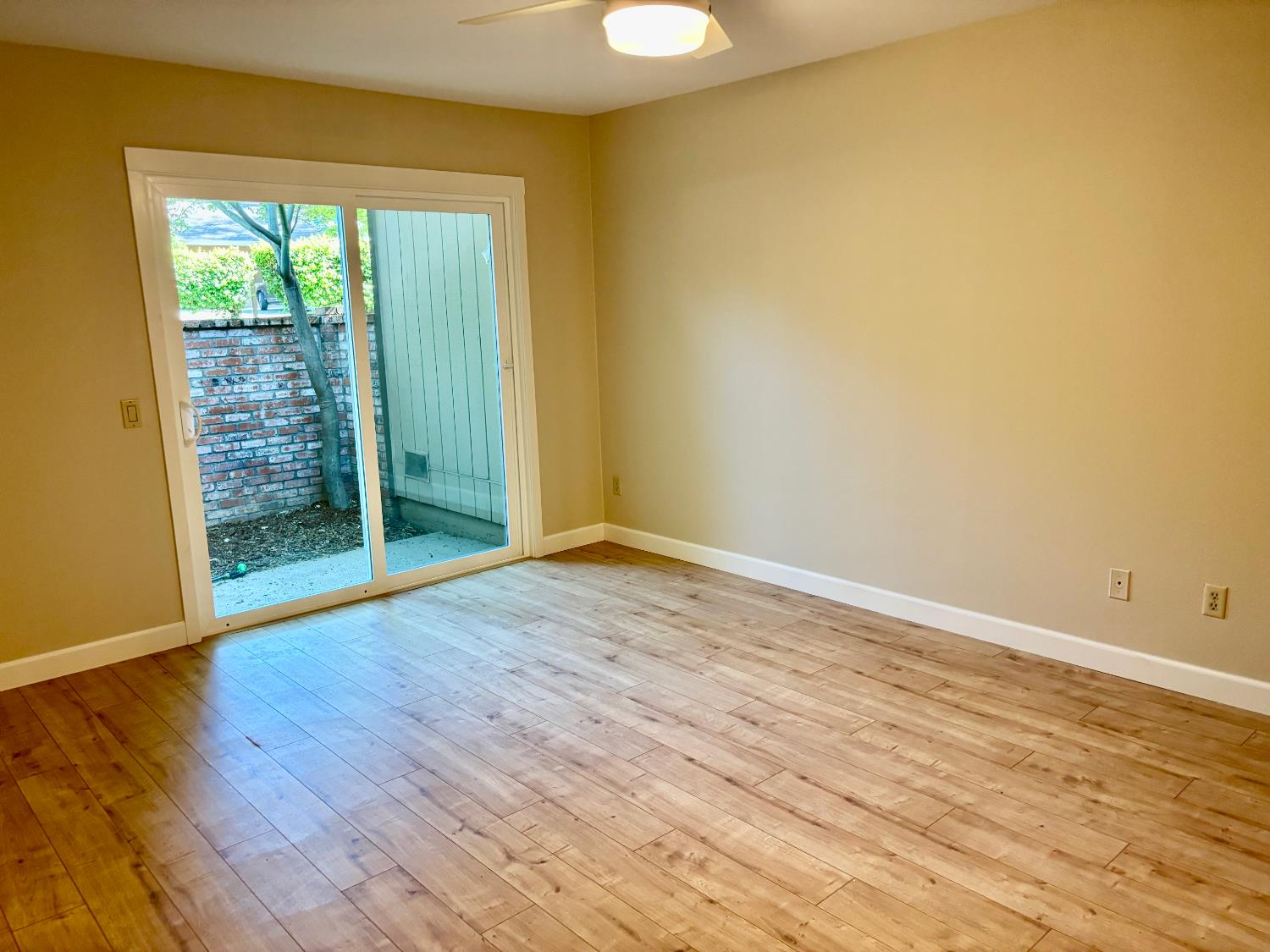 7029 Rio Cuarto Court Citrus Heights, CA 95621 - Photo 16 of 36 Newly installed slider in the primary room overlooking an enclosed area