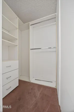 a view of an empty walk in closet