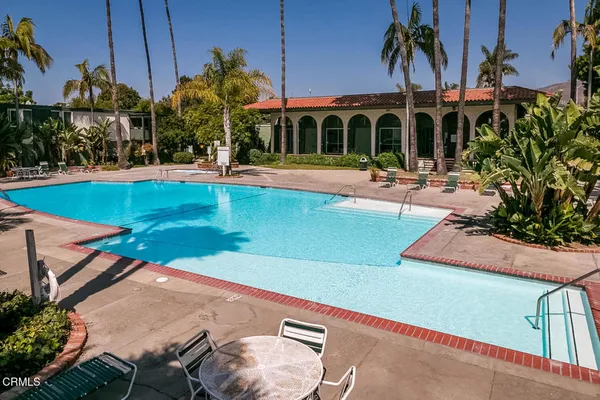 a view of a patio with swimming pool
