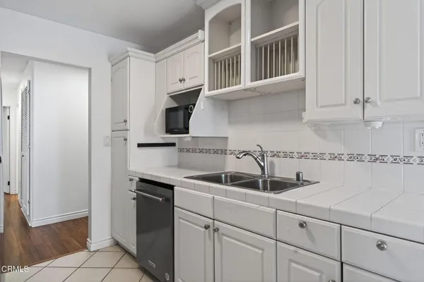a kitchen with a sink and cabinets