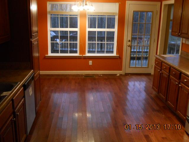675 Sugar Flat Road Lebanon, TN 37087 - Photo 12 of 20 an empty room with wooden floor and windows
